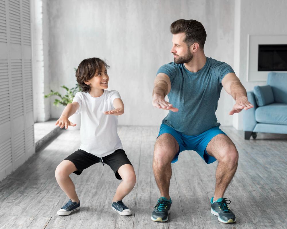 kid-and-his-father-doing-sport-at-home yoga kundalini